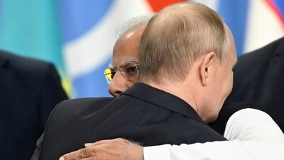Russia's President Vladimir Putin and Prime Minister Narendra Modi embrace at the end of the extended format meeting of the BRICS summit. (AP)