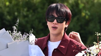 Fans are buzzing over BTS Jin's upcoming appearance on the Korean show Salon Drip 2. (Photo by JUNG YEON-JE / AFP) (AFP) Fans are buzzing over BTS Jin's upcoming appearance on the Korean show Salon Drip 2. (Photo by JUNG YEON-JE / AFP) (AFP)