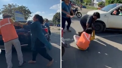 The image shows a group of tourists, including two women, beating a security guard over a parking dispute. (X/@SIVARAMAN74) The image shows a group of tourists, including two women, beating a security guard over a parking dispute. (X/@SIVARAMAN74)