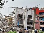 An under-construction building collapsed at Babusapalya amidst the ongoing heavy rainfall, in Bengaluru on Tuesday. (ANI)