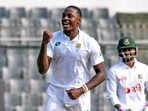 South Africa's Kagiso Rabada (L) reacts