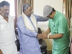 Chief minister Siddaramaiah and deputy chief minister DK Shivakumar with former BJP MLC CP Yogeshwar in Bengaluru on Wednesday. (PTI) Chief minister Siddaramaiah and deputy chief minister DK Shivakumar with former BJP MLC CP Yogeshwar in Bengaluru on Wednesday. (PTI)