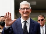 Apple CEO Tim Cook waves to journalists after his meeting with Indonesian President Joko Widodo at the Presidential Palace in Jakarta, Indonesia.