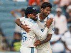 India's Washington Sundar and Rohit Sharma celebrate the wicket of New Zealand's Tim Southee during the first day of the second Test India's Washington Sundar and Rohit Sharma celebrate the wicket of New Zealand's Tim Southee during the first day of the second Test