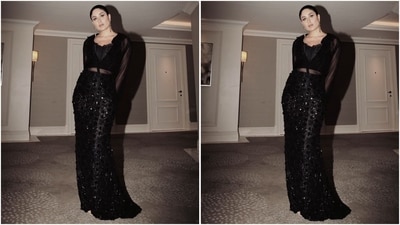 For her look, Kareena donned a Dolce & Gabbana ensemble featuring a black corset top layered with sheer, full-sleeved blouse adorned with ruched detailing, priced at <span class='webrupee'>₹</span>1,82,185. (Instagram/@kareenakapoorkhan) For her look, Kareena donned a Dolce & Gabbana ensemble featuring a black corset top layered with sheer, full-sleeved blouse adorned with ruched detailing, priced at <span class='webrupee'>₹</span>1,82,185. (Instagram/@kareenakapoorkhan)