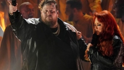 Jelly Roll, left, and Wynonna Judd perform "Need a Favor" at the 57th Annual CMA Awards on Wednesday, Nov. 8, 2023, at the Bridgestone Arena in Nashville, Tenn. (AP Photo/George Walker IV) (George Walker IV/Invision/AP)