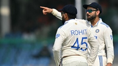 India's Virat Kohli (R) talks to captain Rohit Sharma. (AFP) India's Virat Kohli (R) talks to captain Rohit Sharma. (AFP)