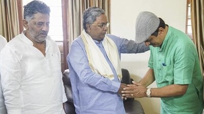 Chief minister Siddaramaiah and deputy chief minister DK Shivakumar with former BJP MLC CP Yogeshwar in Bengaluru on Wednesday. (PTI) Chief minister Siddaramaiah and deputy chief minister DK Shivakumar with former BJP MLC CP Yogeshwar in Bengaluru on Wednesday. (PTI)