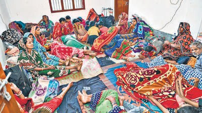 Evacuated villagers rest at a cyclone shelter ahead of the cyclone 'Dana' landfall in Bhadrak district on Thursday. (PTI)