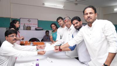 In Pune, cabinet ministers Chandrakant Patil (in pic) and Dilip Walse Patil, along with former Indapur MLA Harshvardhan Patil, and others submitting nomination papers. (HT)