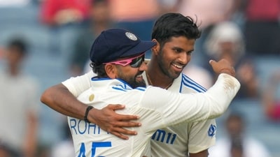 India's Washington Sundar , right, and India's captain Rohit Sharma celebrates the dismissal of New Zealand's Tim Southee during the day one of the second cricket test match between India and New Zealand at the Maharashtra Cricket Association Stadium , in Pune, India, Thursday, Oct. 24, 2024. (AP Photo/Rafiq Maqbool) (AP) India's Washington Sundar , right, and India's captain Rohit Sharma celebrates the dismissal of New Zealand's Tim Southee during the day one of the second cricket test match between India and New Zealand at the Maharashtra Cricket Association Stadium , in Pune, India, Thursday, Oct. 24, 2024. (AP Photo/Rafiq Maqbool) (AP)