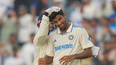 India's Washington Sundar , right, and India's Rishabh Pant react to the dismissal of New Zealand's Mitchell Santner. (AP Photo/Rafiq Maqbool) (AP) India's Washington Sundar , right, and India's Rishabh Pant react to the dismissal of New Zealand's Mitchell Santner. (AP Photo/Rafiq Maqbool) (AP)