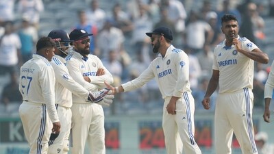 India's Ravichandran Ashwin, second from right, celebrates the dismissal of New Zealand's captain Tom Latham with his team players during the day one of the second cricket test match between India and New Zealand at the Maharashtra Cricket Association Stadium , in Pune, India, Thursday, Oct. 24, 2024. (AP Photo/Rafiq Maqbool) (AP) India's Ravichandran Ashwin, second from right, celebrates the dismissal of New Zealand's captain Tom Latham with his team players during the day one of the second cricket test match between India and New Zealand at the Maharashtra Cricket Association Stadium , in Pune, India, Thursday, Oct. 24, 2024. (AP Photo/Rafiq Maqbool) (AP)