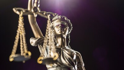 Lady Justice is usually represented as blindfolded and holding a set of scales Lady Justice is usually represented as blindfolded and holding a set of scales