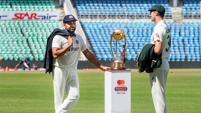 Indian captain Rohit Sharma interacts with his Australian counterpart Pat Cummins (PTI) Indian captain Rohit Sharma interacts with his Australian counterpart Pat Cummins (PTI)