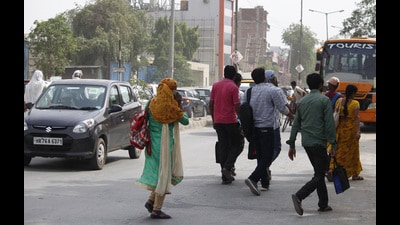 Pedestrians crossing a busy road in the Jwala Mill area. (HT Archive)