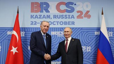 Russia's President Vladimir Putin (right) and Turkey's President Recep Tayyip Erdogan (left) shaking hands as they meet on the sidelines of the BRICS summit in Kazan, on Wednesday. (AFP) Russia's President Vladimir Putin (right) and Turkey's President Recep Tayyip Erdogan (left) shaking hands as they meet on the sidelines of the BRICS summit in Kazan, on Wednesday. (AFP)