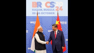This photograph shared by Ministry of Information and Broadcasting, Government of India, on the X platform shows Chinese President Xi Jinping, right, shaking hands with Indian Prime Minister Narendra Modi, on the sidelines of the BRICS Summit in Kazan, Russia, Wednesday, Oct. 23, 2024. (Ministry of Information and Broadcasting, Government of India, on X via AP) (AP)