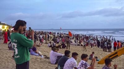 Tourists at a beach in north Goa's Calangute on October 17. (PTI Photo) Tourists at a beach in north Goa's Calangute on October 17. (PTI Photo)