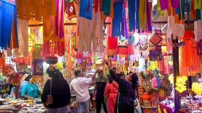 People in Mumbai shop for decorative items at a market on Thursday, ahead of the Diwali festival, adding to the festive atmosphere in the city. (PTI Photo) People in Mumbai shop for decorative items at a market on Thursday, ahead of the Diwali festival, adding to the festive atmosphere in the city. (PTI Photo)