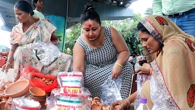 Women in Guwahati shop for earthen lamps (diyas) and decorations as Diwali approaches. The festive preparations are in full swing with vibrant markets bustling with activity. (ANI Photos) Women in Guwahati shop for earthen lamps (diyas) and decorations as Diwali approaches. The festive preparations are in full swing with vibrant markets bustling with activity. (ANI Photos)