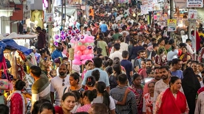  Rajkot's market buzzes with activity as shoppers flock to buy festive goods ahead of Diwali. (PTI Photo) Rajkot's market buzzes with activity as shoppers flock to buy festive goods ahead of Diwali. (PTI Photo)