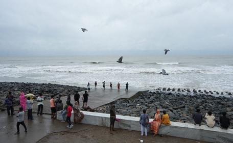Visitors at the beach at Digha ahead of the landfall of Cyclone 'Dana', in Purba Medinipur district, West Bengal, on October 24, 2024. (PTI) Visitors at the beach at Digha ahead of the landfall of Cyclone 'Dana', in Purba Medinipur district, West Bengal, on October 24, 2024. (PTI)