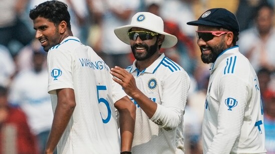 Pune: India's Washington Sundar celebrates with captain Rohit Sharma and Ravindra Jadeja after taking the wicket of New Zealand's Rachin Ravindra. (PTI Photo/Kunal Patil) (PTI10_24_2024_000121A) (PTI)