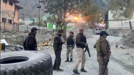 Security personnel cordon off the area after a terrorist attack in Ganderbal district on Monday. (PTI)