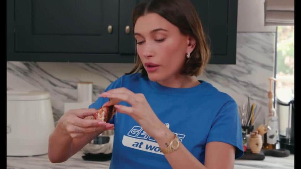 Hailey Bieber’s pizza toast calls for fresh tomatoes, burrata, parmesan, and sourdough.