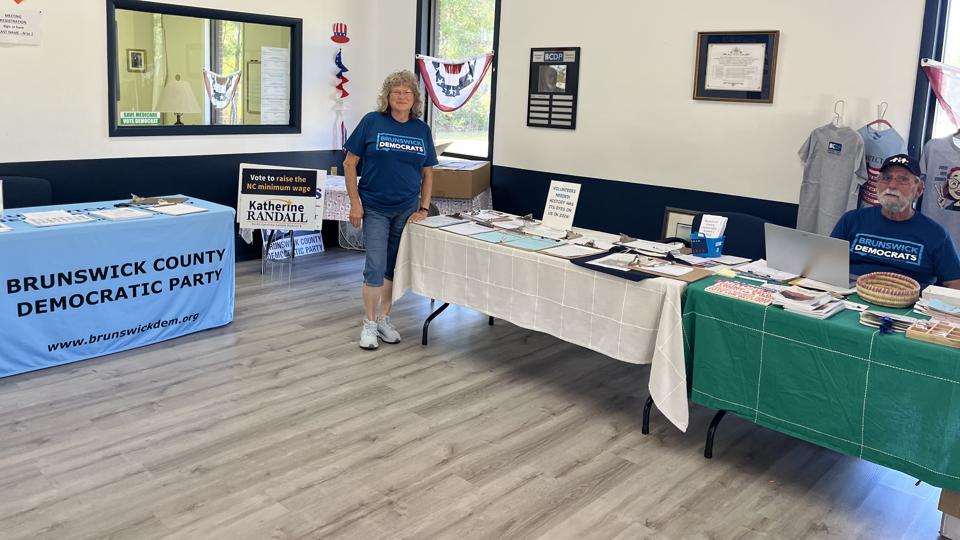 Mark and Amy moved from Ohio and now volunteer at the Democratic Party headquarters in Brunswick County. They flag the threat of misinformation. (HT) Mark and Amy moved from Ohio and now volunteer at the Democratic Party headquarters in Brunswick County. They flag the threat of misinformation. (HT)