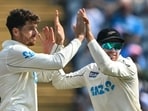 New Zealand's Mitchell Santner celebrates with his captain Tom Latham (R) after taking the wicket of India's Virat Kohli New Zealand's Mitchell Santner celebrates with his captain Tom Latham (R) after taking the wicket of India's Virat Kohli