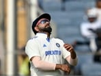 India's captain Rohit Sharma reacts during the second day of the second Test cricket match against New Zealand at the Maharashtra Cricket Association Stadium in Pune