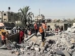 Palestinians check a building destroyed by Israeli airstrikes in the city of Khan Younis, southern Gaza Strip, Friday, Oct. 25, 2024. Palestinians check a building destroyed by Israeli airstrikes in the city of Khan Younis, southern Gaza Strip, Friday, Oct. 25, 2024.