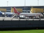An IndiGo aircraft and an Air India Ltd. aircraft on the tarmac at Indira Gandhi International Airport in New Delhi. An IndiGo aircraft and an Air India Ltd. aircraft on the tarmac at Indira Gandhi International Airport in New Delhi.