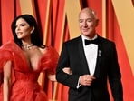 Lauren Sanchez, left, and Jeff Bezos arrive at the Vanity Fair Oscar Party. 