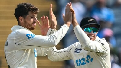 New Zealand's Mitchell Santner celebrates with his captain Tom Latham (R) after taking the wicket of India's Virat Kohli (AFP) New Zealand's Mitchell Santner celebrates with his captain Tom Latham (R) after taking the wicket of India's Virat Kohli (AFP)