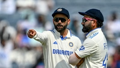 India's Virat Kohli talks with his captain Rohit Sharma (AFP) India's Virat Kohli talks with his captain Rohit Sharma (AFP)