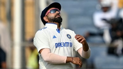 India's captain Rohit Sharma reacts during the second day of the second Test cricket match against New Zealand at the Maharashtra Cricket Association Stadium in Pune (AFP) India's captain Rohit Sharma reacts during the second day of the second Test cricket match against New Zealand at the Maharashtra Cricket Association Stadium in Pune (AFP)