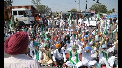 Farmers staging a protest in Lalru on Friday. (HT File)