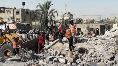 Palestinians check a building destroyed by Israeli airstrikes in the city of Khan Younis, southern Gaza Strip, Friday, Oct. 25, 2024. (AP) Palestinians check a building destroyed by Israeli airstrikes in the city of Khan Younis, southern Gaza Strip, Friday, Oct. 25, 2024. (AP)