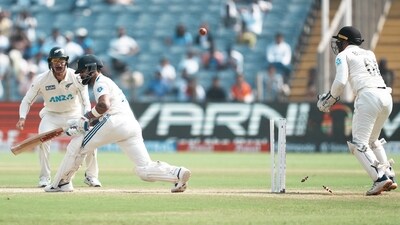 India's Virat Kohli being bowled by New Zealand's Mitchell Santner on the second day of the second test cricket match between India and New Zealand, at the Maharashtra Cricket Association Stadium, in Pune (PTI) India's Virat Kohli being bowled by New Zealand's Mitchell Santner on the second day of the second test cricket match between India and New Zealand, at the Maharashtra Cricket Association Stadium, in Pune (PTI)