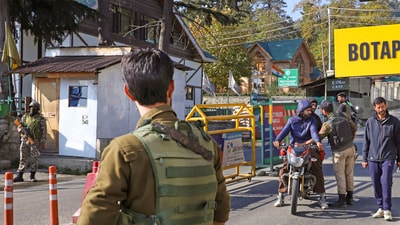 Security personnel keep vigil on the Gulmarg-Botapathri road during a search operation following a terror attack on an army vehicle, in Gulmarg, Jammu and Kashmir, on Friday. (PTI) Security personnel keep vigil on the Gulmarg-Botapathri road during a search operation following a terror attack on an army vehicle, in Gulmarg, Jammu and Kashmir, on Friday. (PTI)