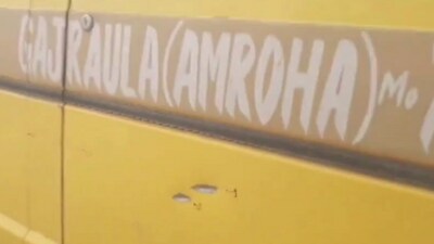 The school van in Amroha which was ambushed by masked men who fired at them (PTI) The school van in Amroha which was ambushed by masked men who fired at them (PTI)
