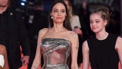 Angelina Jolie dresses up in silver bodycon gown with Zahara Jolie-Pitt and Shiloh for Eternals premiere (AFP)