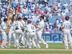 New Zealand's Mitchell Santner and teammates celebrate the wicket of India's Virat Kohli. New Zealand's Mitchell Santner and teammates celebrate the wicket of India's Virat Kohli.