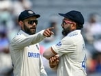 India's Virat Kohli talks with his captain Rohit Sharma (R). India's Virat Kohli talks with his captain Rohit Sharma (R).