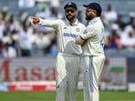 India's Virat Kohli talks with his captain Rohit Sharma (R) during the second Test against New Zealand. (Photo by Punit PARANJPE / AFP) / -- IMAGE RESTRICTED TO EDITORIAL USE - STRICTLY NO COMMERCIAL USE -- India's Virat Kohli talks with his captain Rohit Sharma (R) during the second Test against New Zealand. (Photo by Punit PARANJPE / AFP) / -- IMAGE RESTRICTED TO EDITORIAL USE - STRICTLY NO COMMERCIAL USE --