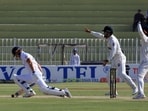 Pakistan players appeal successfully for the wicket of England's Ben Stokes, lbw bowled by Pakistan's Noman Ali