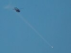 Israel attacks Iran live: An Israeli Apache attack helicopter fires a missile towards southern Lebanon, amid ongoing hostilities between Hezbollah and Israel, as seen from near Ein Ya'akov, northern Israel, October 26, 2024. 